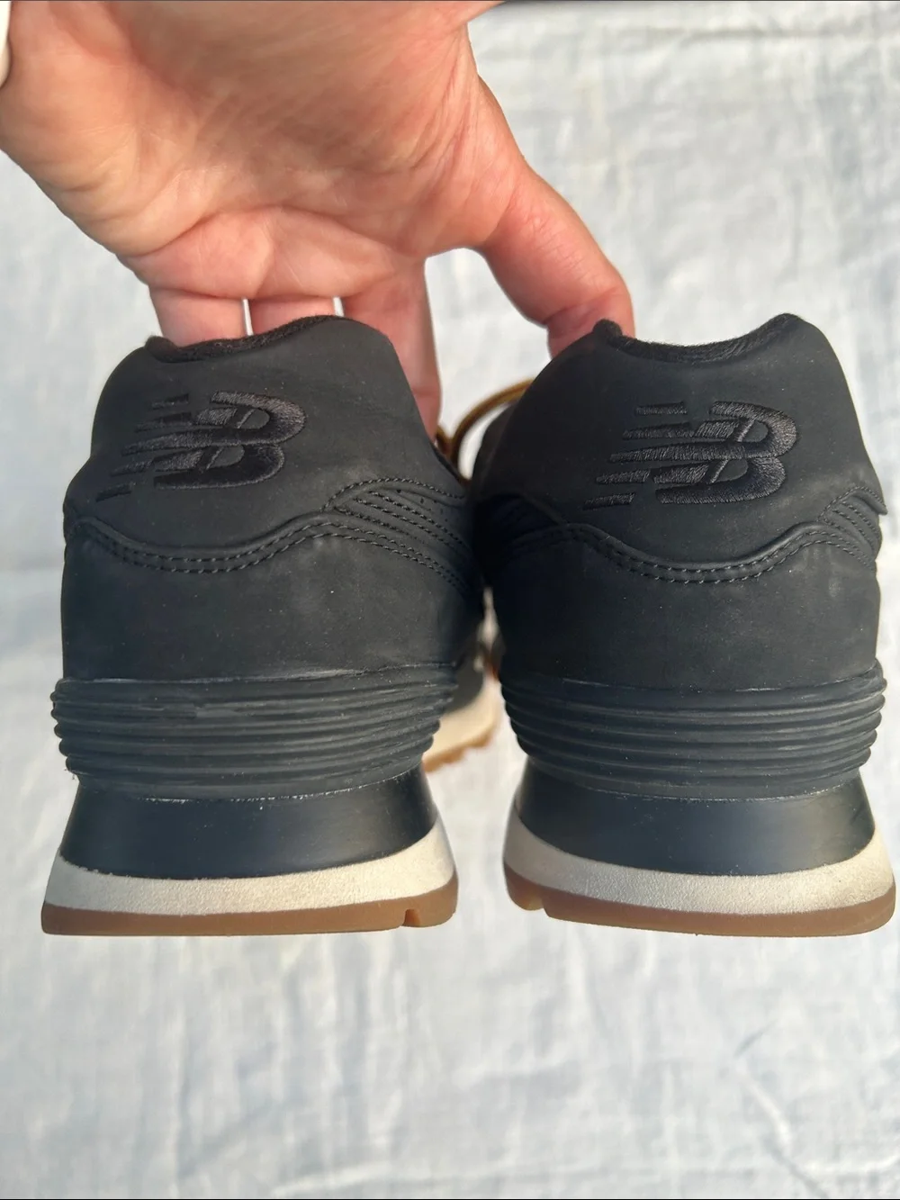 New Balance Men’s Black Sneakers with Tan Sole and Yellow-Orange Laces